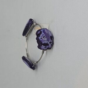 Silver wire bracelet with purple stones